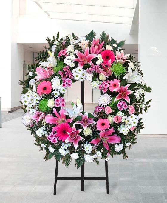 Couronne funéraire roses et lys — livraison Paris